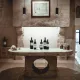 Salle de dégustation en pierre avec cinq bouteilles de vin sur une table centrale.